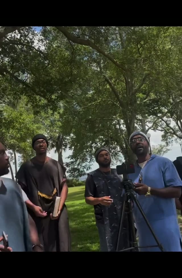 Young white man educates some niggers